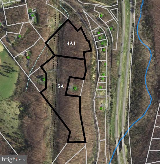 a view of a balcony with wooden floor and fence