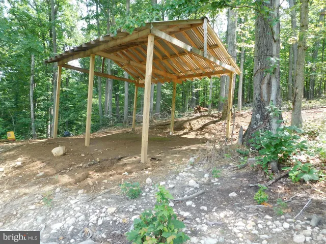 a view of a house with backyard from a patio