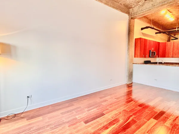 a view of a bathroom with wooden floor and a sink