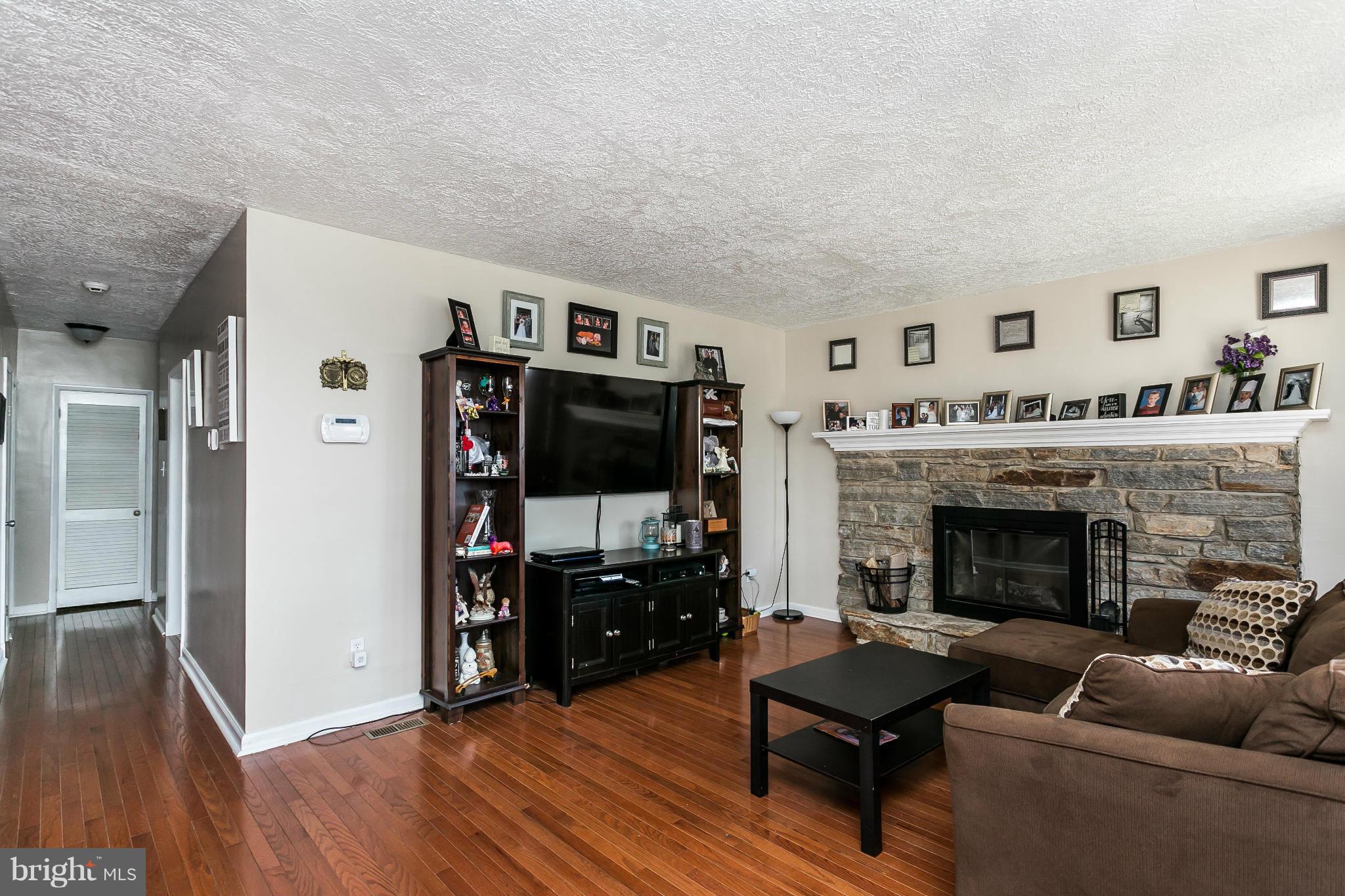 1217 Gettig Road Baltimore, MD 21237 - Photo 14 of 22 a living room with furniture and a fireplace