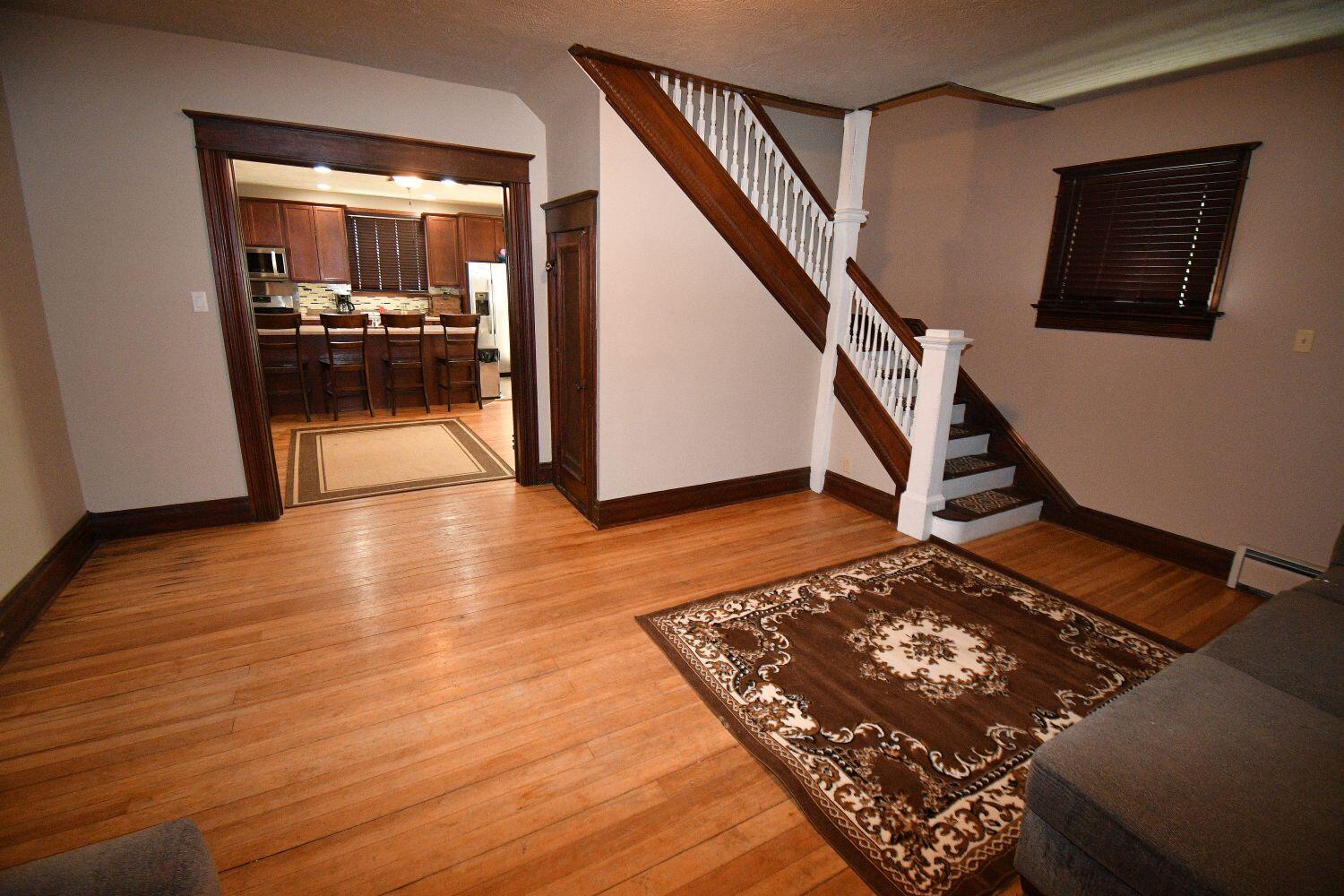 513 North College Avenue Rensselaer, IN 47978 - Photo 15 of 29 a view of a hallway with wooden floor and staircase