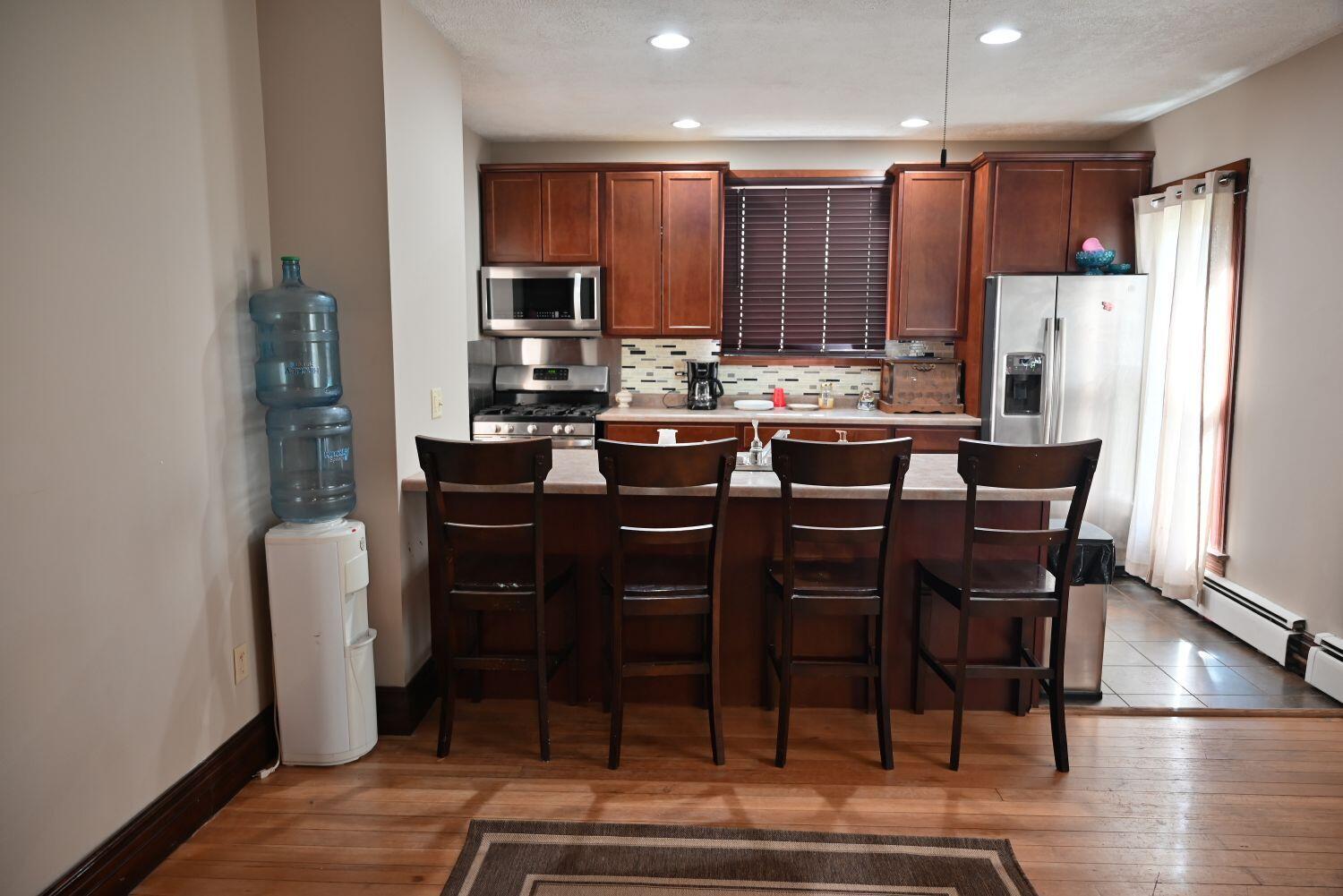 513 North College Avenue Rensselaer, IN 47978 - Photo 7 of 29 a view of a dining room with furniture window and wooden floor