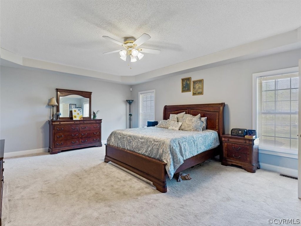 11736 Winterpock Road Chesterfield, VA 23838 - Photo 21 of 50 a spacious bedroom with a bed and a chandelier