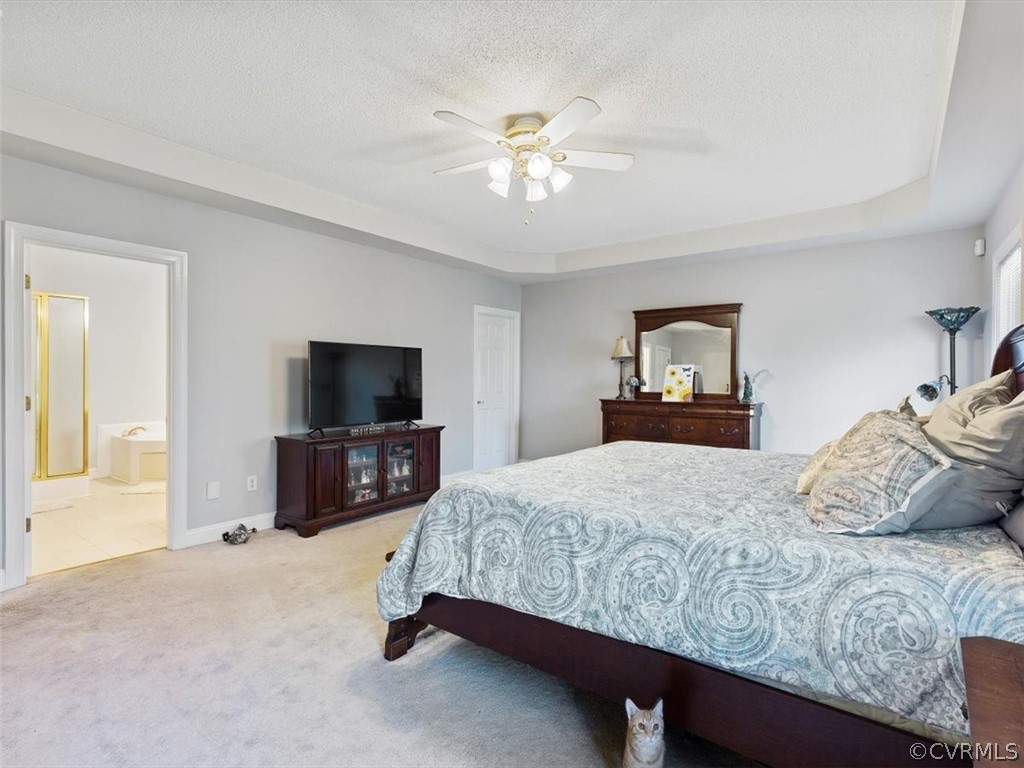 11736 Winterpock Road Chesterfield, VA 23838 - Photo 22 of 50 a bedroom with a bed and a flat screen tv