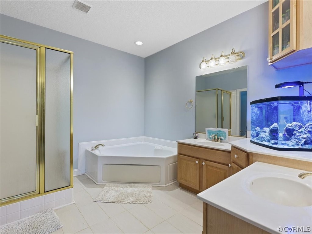 11736 Winterpock Road Chesterfield, VA 23838 - Photo 23 of 50 a bathroom with a sink a toilet and shower