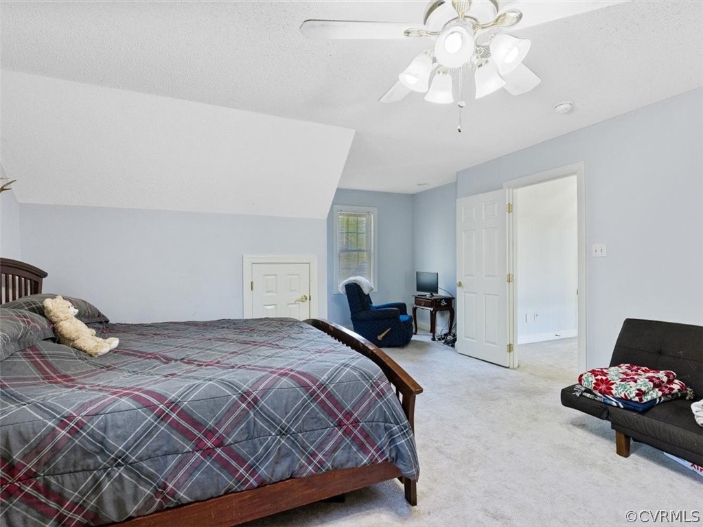 11736 Winterpock Road Chesterfield, VA 23838 - Photo 28 of 50 a bedroom with a bed and a chandelier