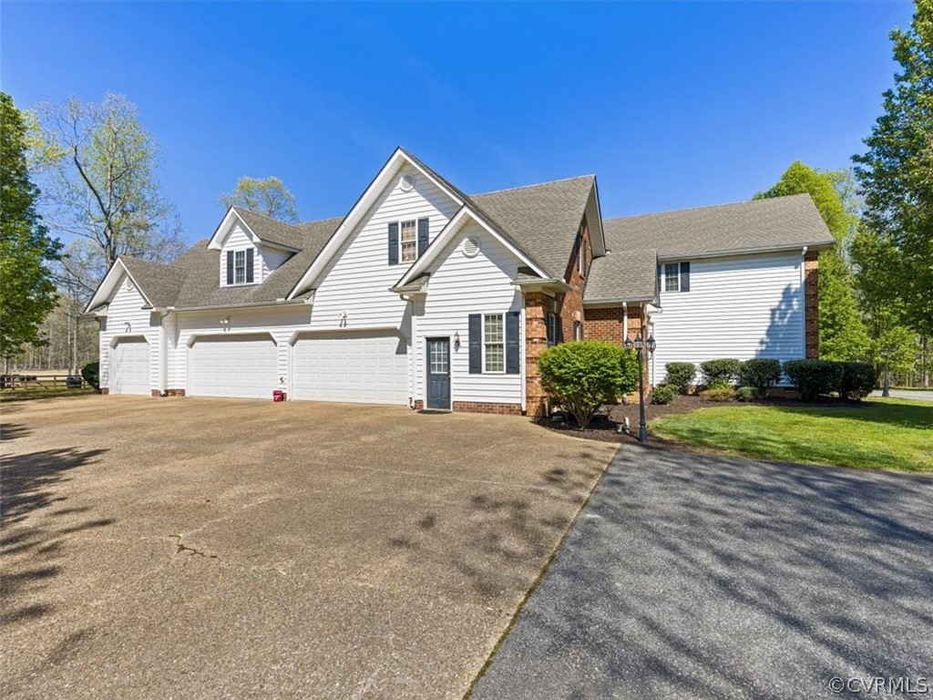 11736 Winterpock Road Chesterfield, VA 23838 - Photo 4 of 50 a front view of a house with a yard and garage