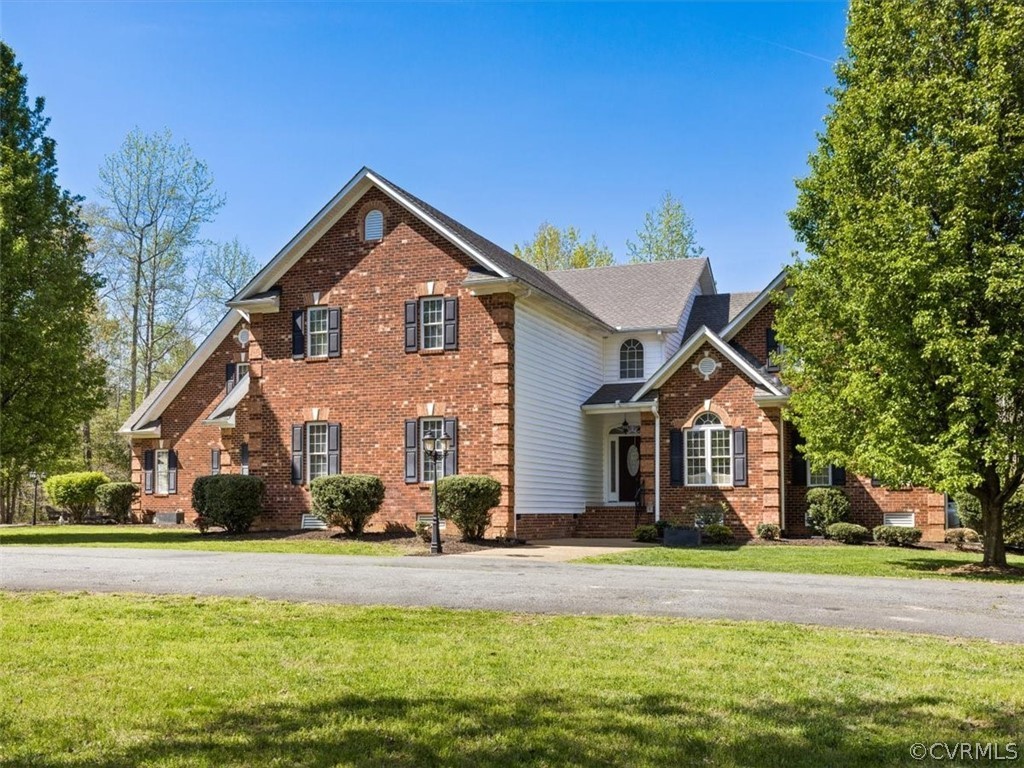 11736 Winterpock Road Chesterfield, VA 23838 - Photo 5 of 50 a front view of a house with a yard