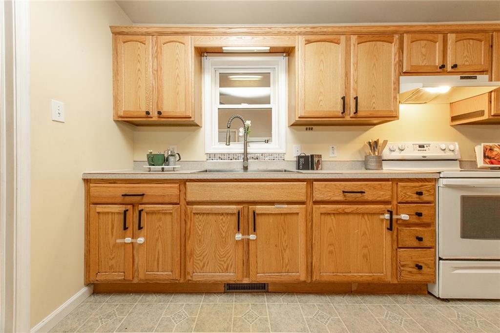 222 Hines Road Slippery Rock, PA 16057 - Photo 13 of 42 a kitchen with stainless steel appliances granite countertop a sink and cabinets