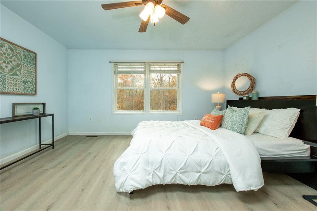 222 Hines Road Slippery Rock, PA 16057 - Photo 20 of 42 a bed sitting in a bedroom next to a window