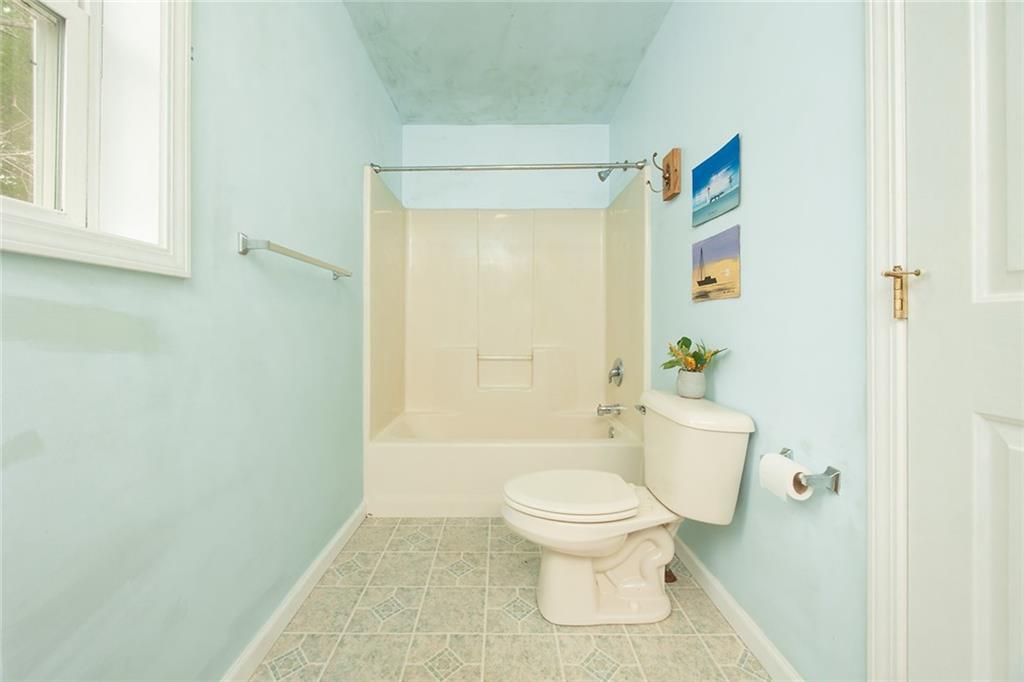 222 Hines Road Slippery Rock, PA 16057 - Photo 23 of 42 a white toilet sitting next to a bathroom sink and a shower