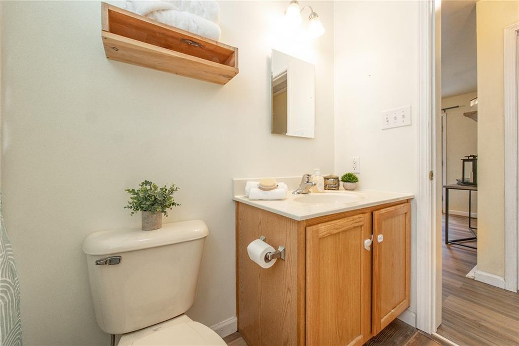 222 Hines Road Slippery Rock, PA 16057 - Photo 25 of 42 a bathroom with a sink mirror vanity and toilet