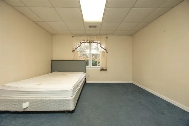 a room with chair and window