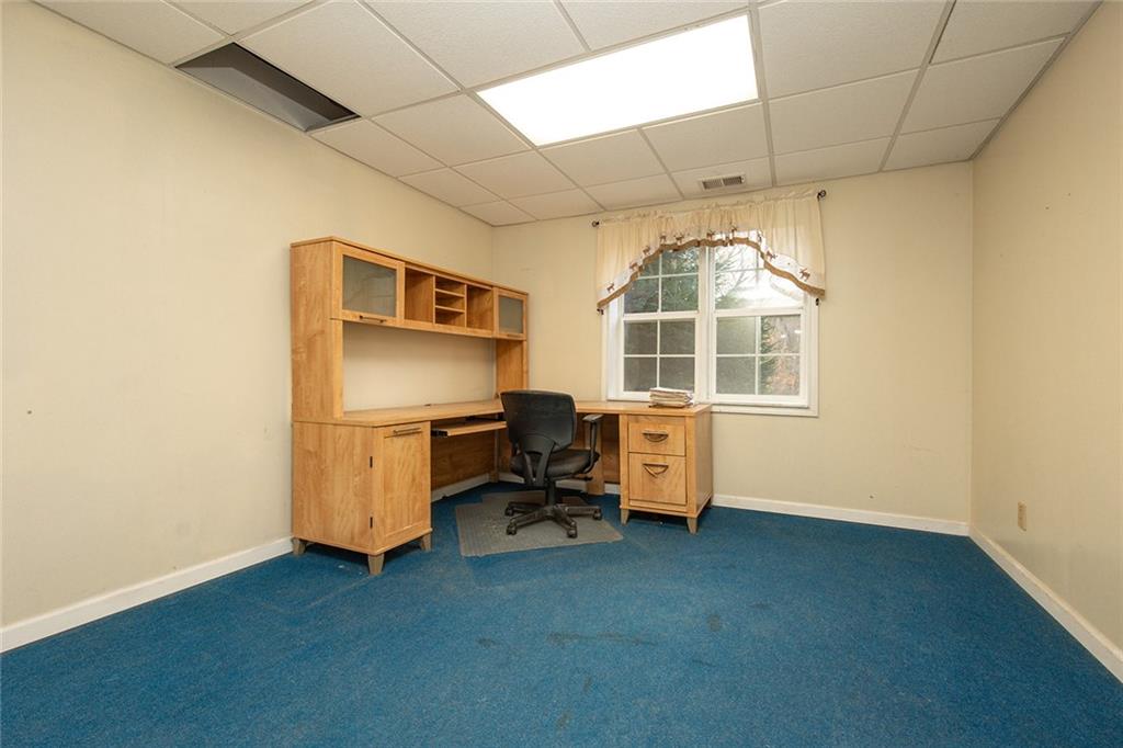 222 Hines Road Slippery Rock, PA 16057 - Photo 32 of 42 a room with chair and window