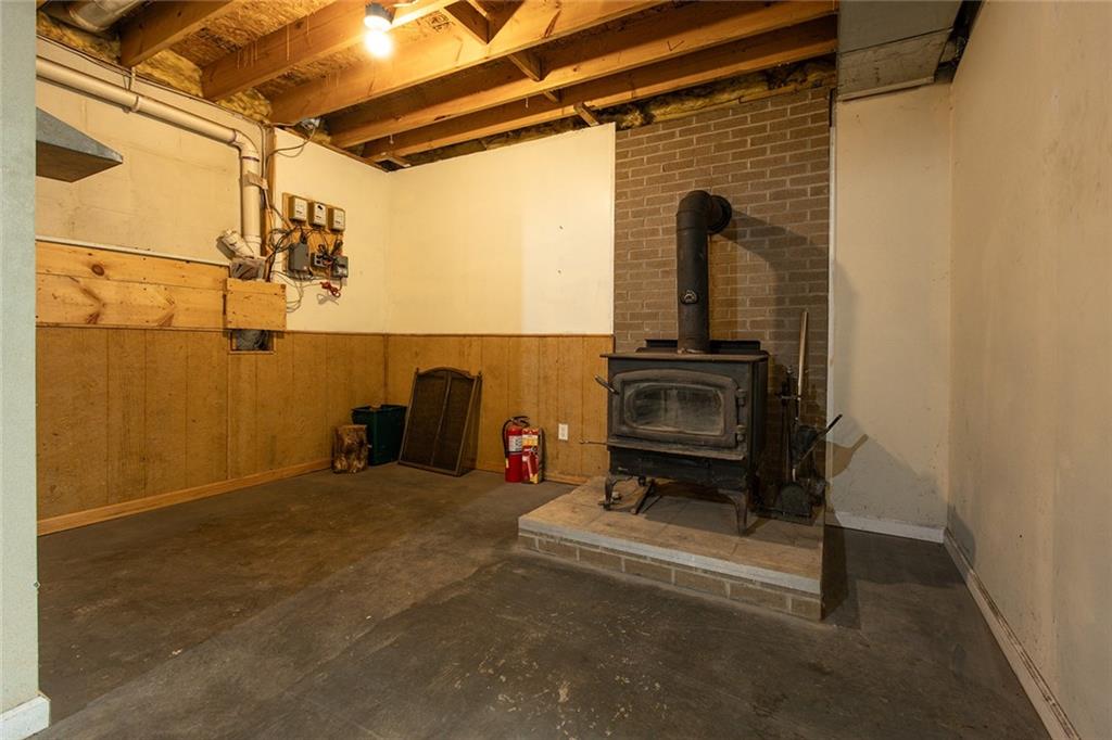 222 Hines Road Slippery Rock, PA 16057 - Photo 36 of 42 a view of a room with a refrigerator and a table