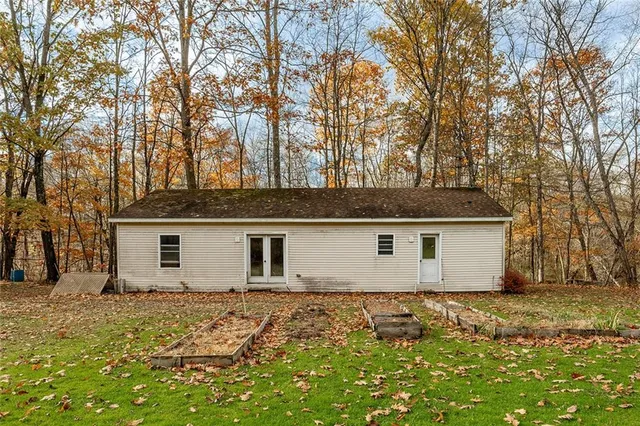 a view of a yard with large trees
