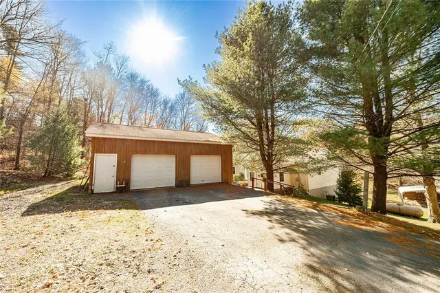 a view of a house with a snow in the yard