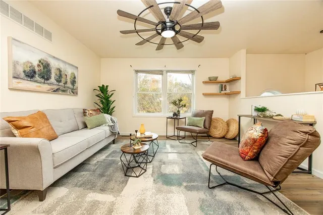 a living room with furniture and a large window
