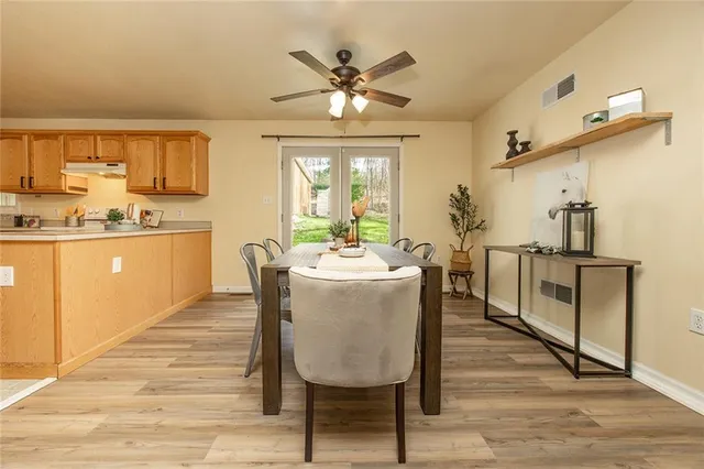 a dining room with furniture and window