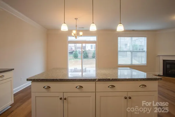 a kitchen with cabinets and window