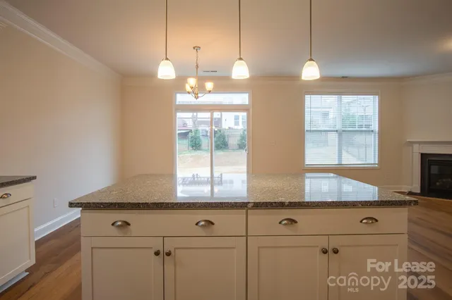 a kitchen with cabinets and window