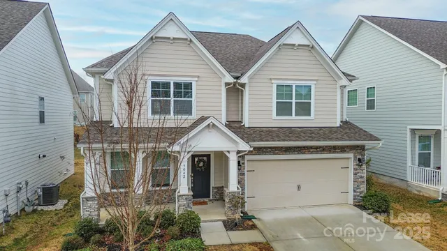 a view of house with yard