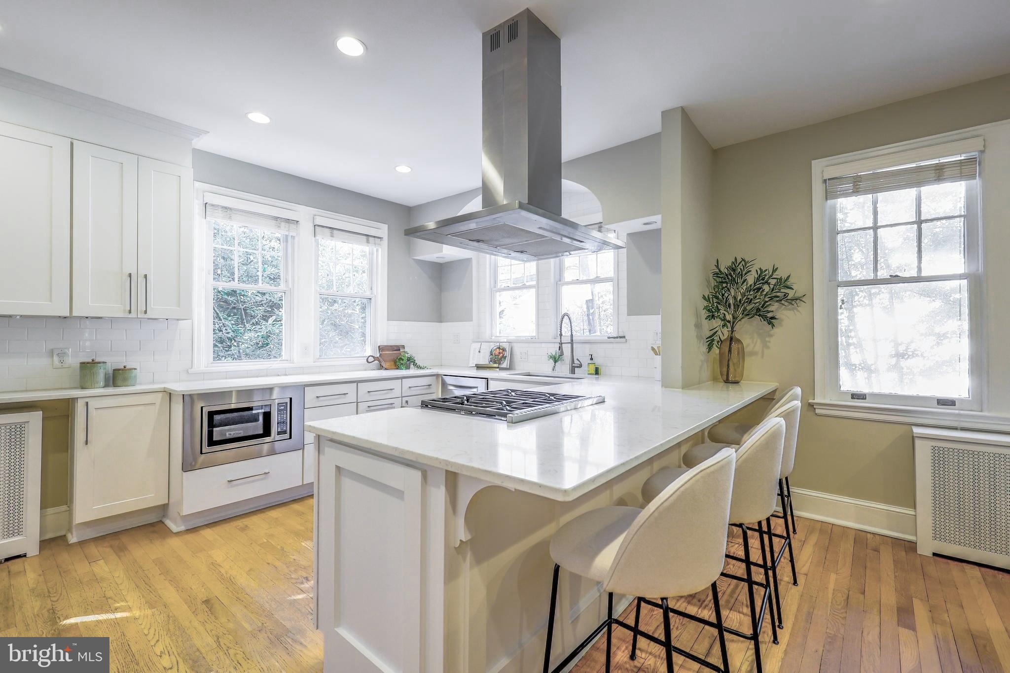 3230 Military Road Northwest Washington, DC 20015 - Photo 15 of 61 a kitchen with stainless steel appliances granite countertop a stove and a sink