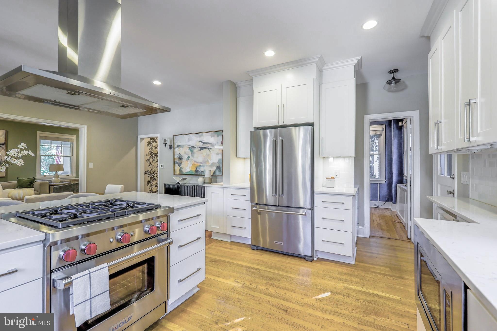 3230 Military Road Northwest Washington, DC 20015 - Photo 18 of 61 a kitchen with stainless steel appliances granite countertop a stove a refrigerator and a cabinets