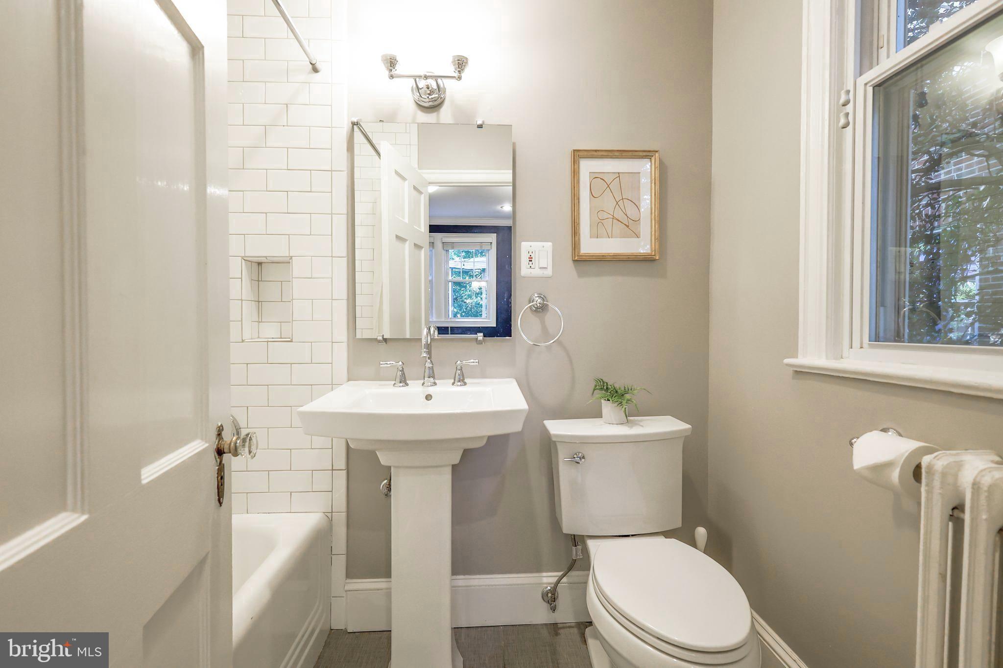3230 Military Road Northwest Washington, DC 20015 - Photo 24 of 61 a bathroom with a sink a toilet and shower