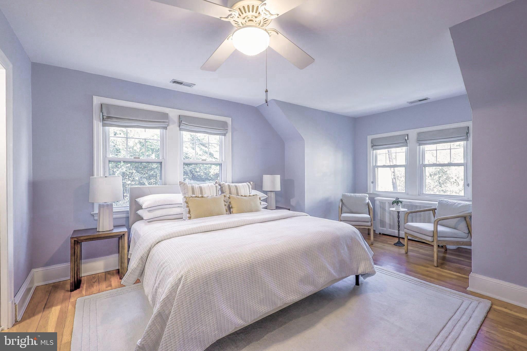 3230 Military Road Northwest Washington, DC 20015 - Photo 26 of 61 a bedroom with a bed and a chandelier