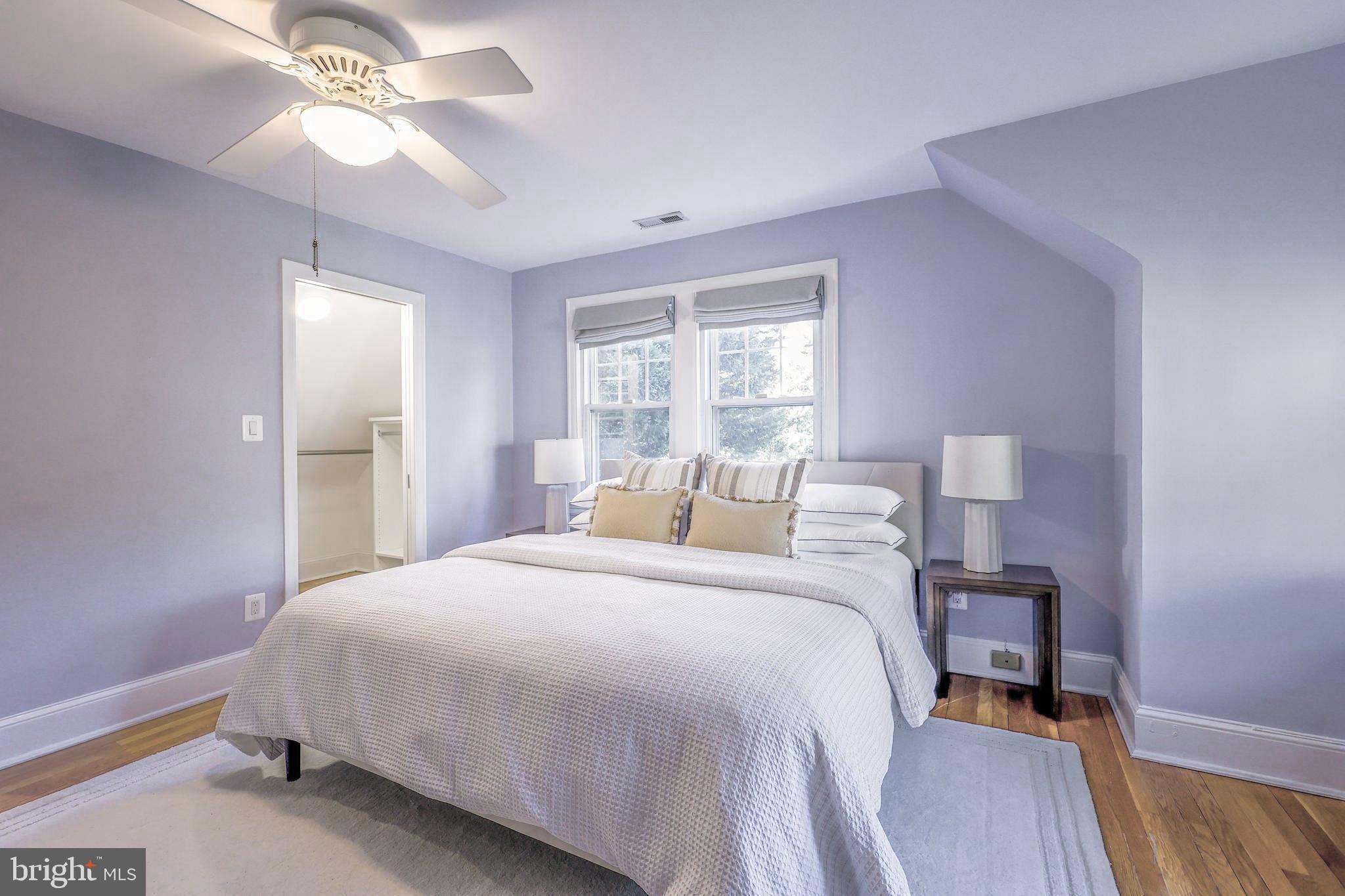 3230 Military Road Northwest Washington, DC 20015 - Photo 27 of 61 a bedroom with a bed and a chandelier