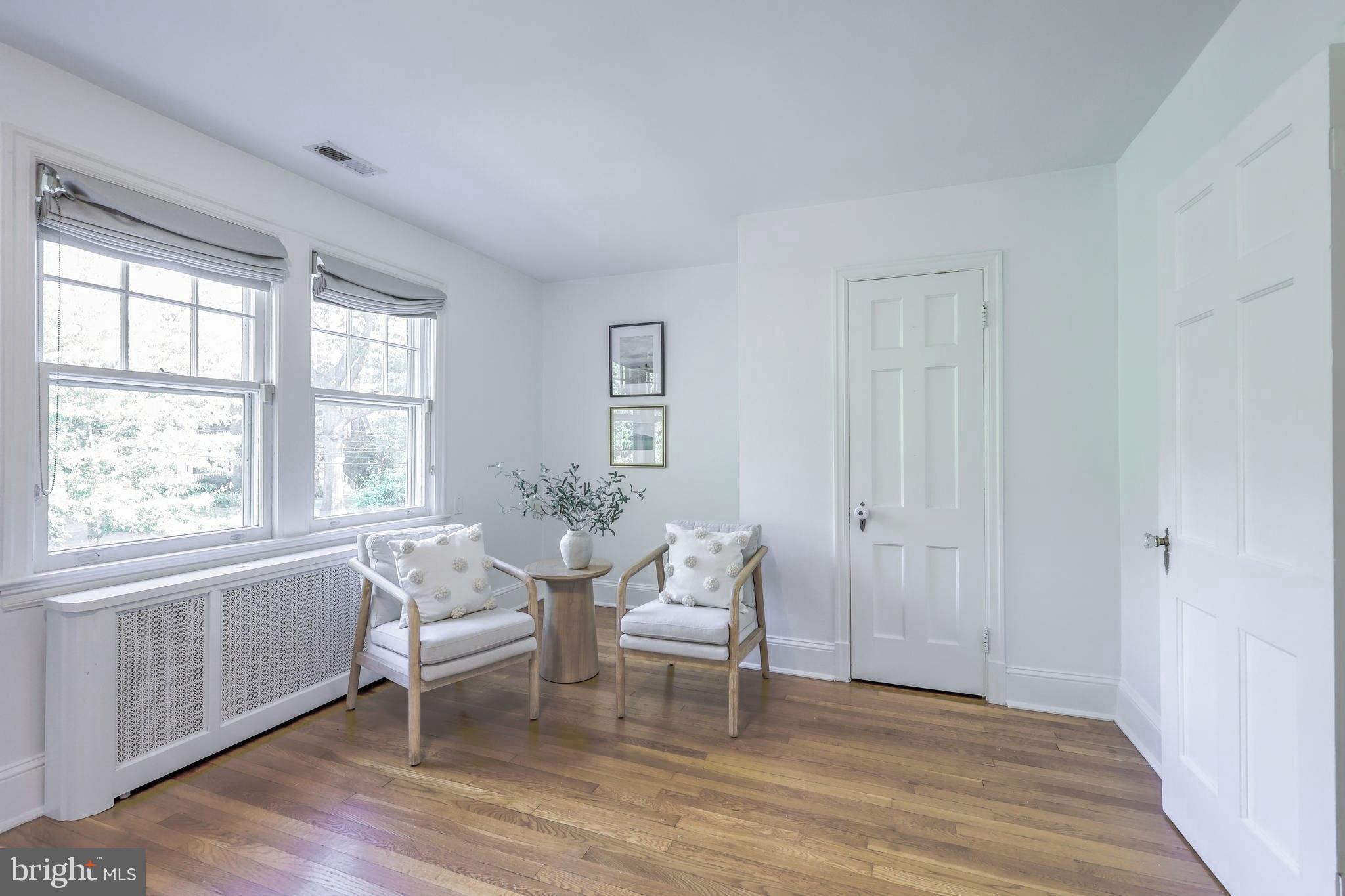 3230 Military Road Northwest Washington, DC 20015 - Photo 37 of 61 a dining room with wooden floor and white walls
