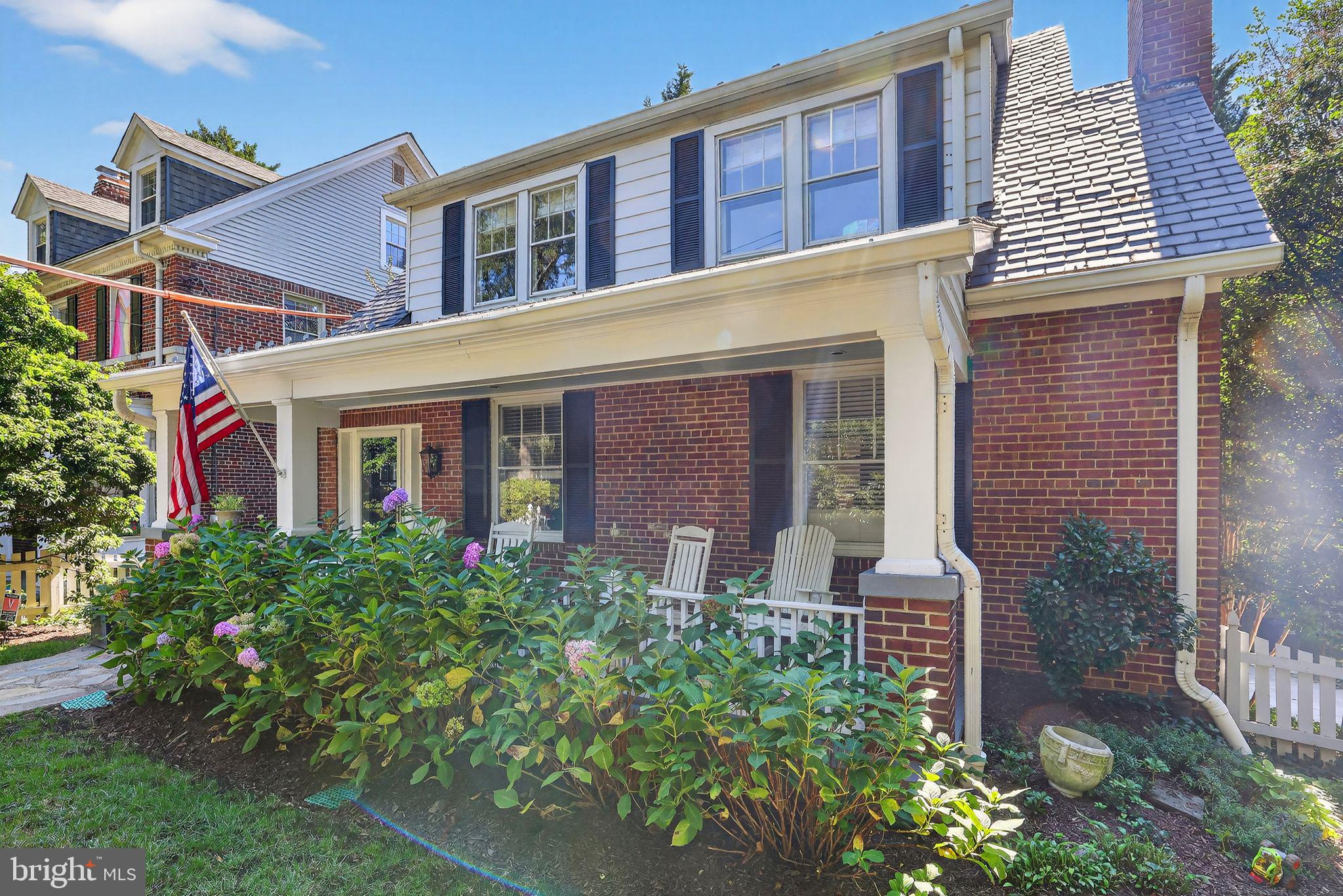 3230 Military Road Northwest Washington, DC 20015 - Photo 4 of 61 front view of a brick house with a large windows