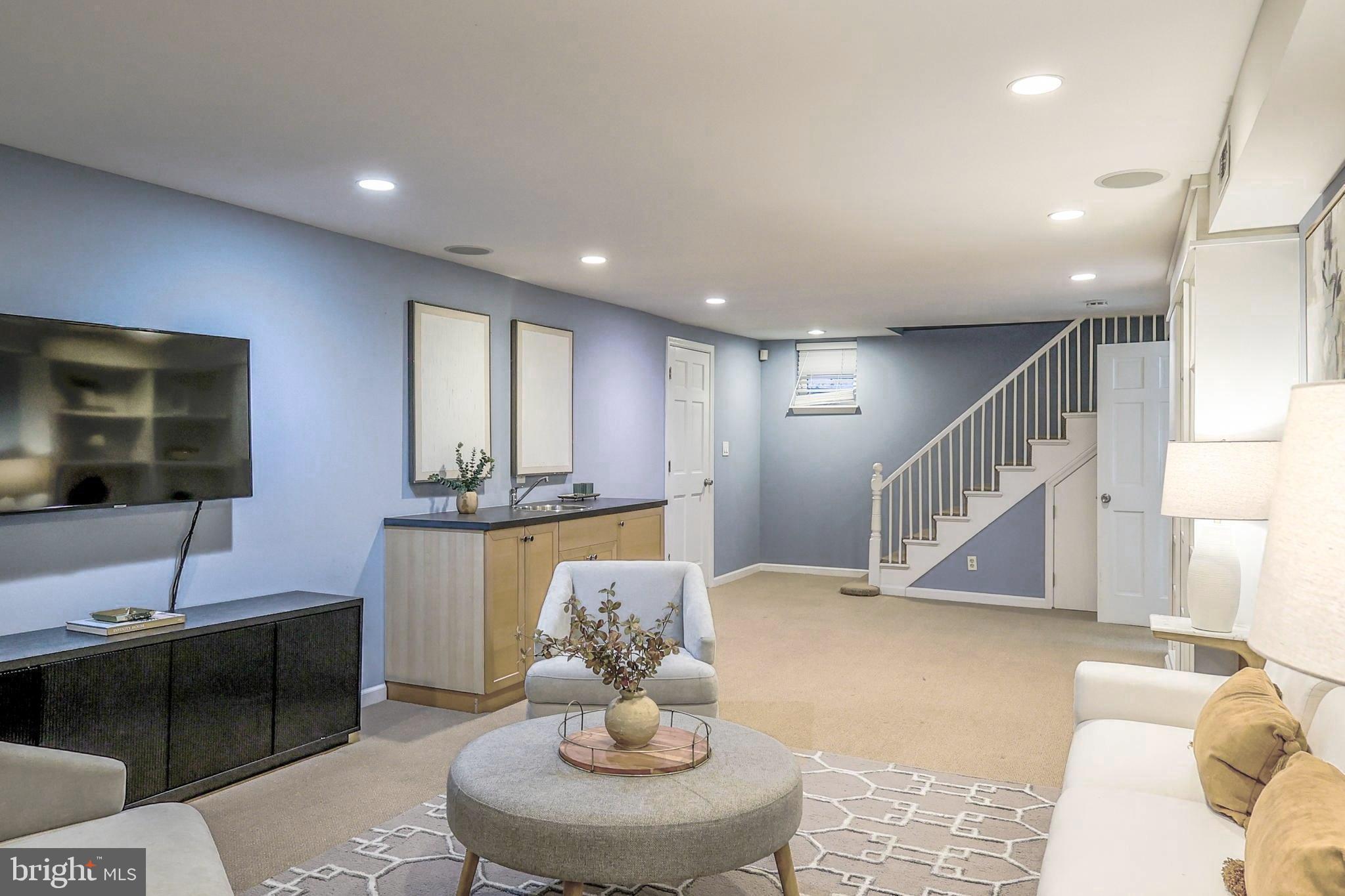 3230 Military Road Northwest Washington, DC 20015 - Photo 44 of 61 a living room with furniture and a flat screen tv