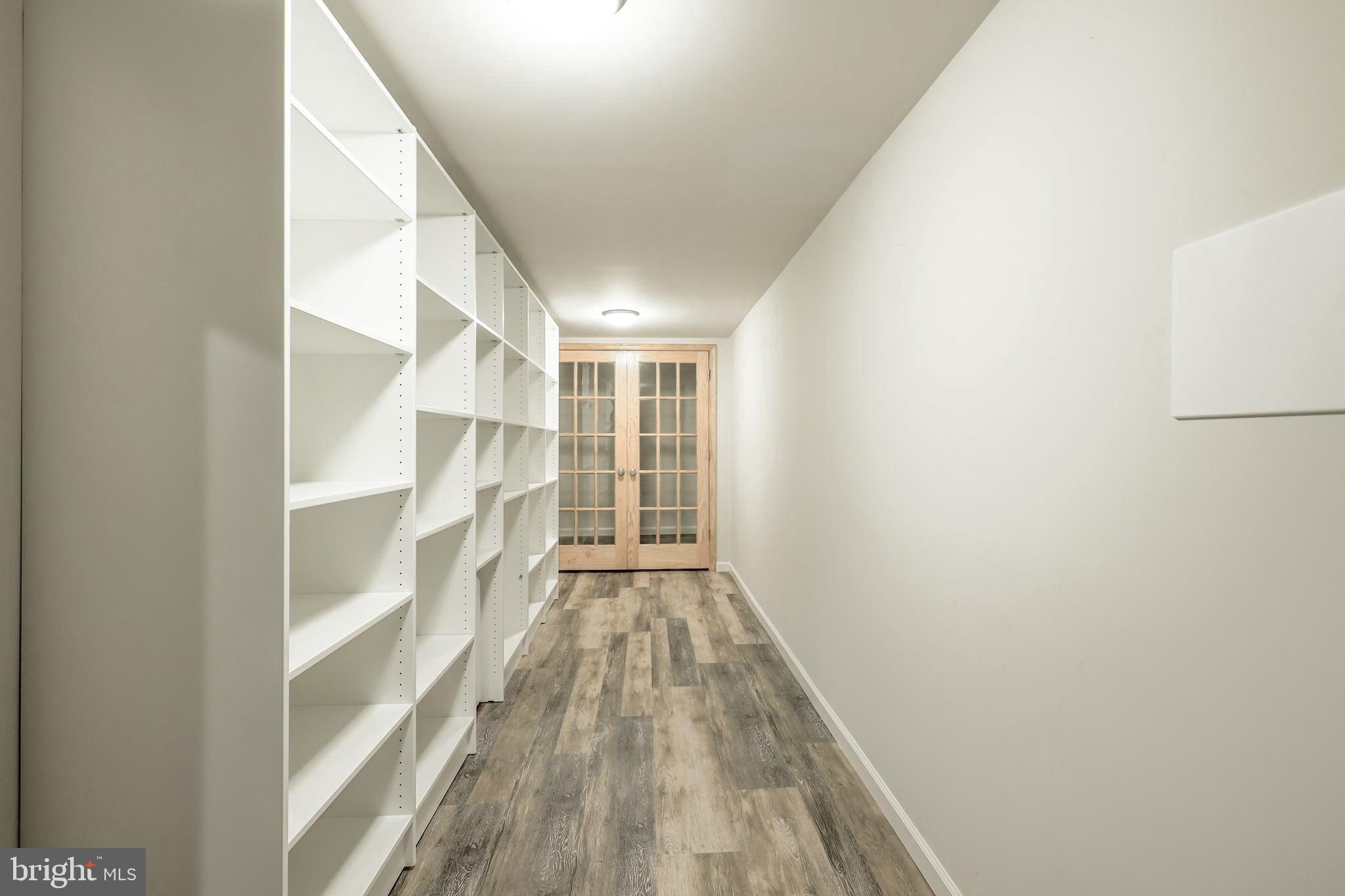 3230 Military Road Northwest Washington, DC 20015 - Photo 46 of 61 a view of walk in closet with empty racks