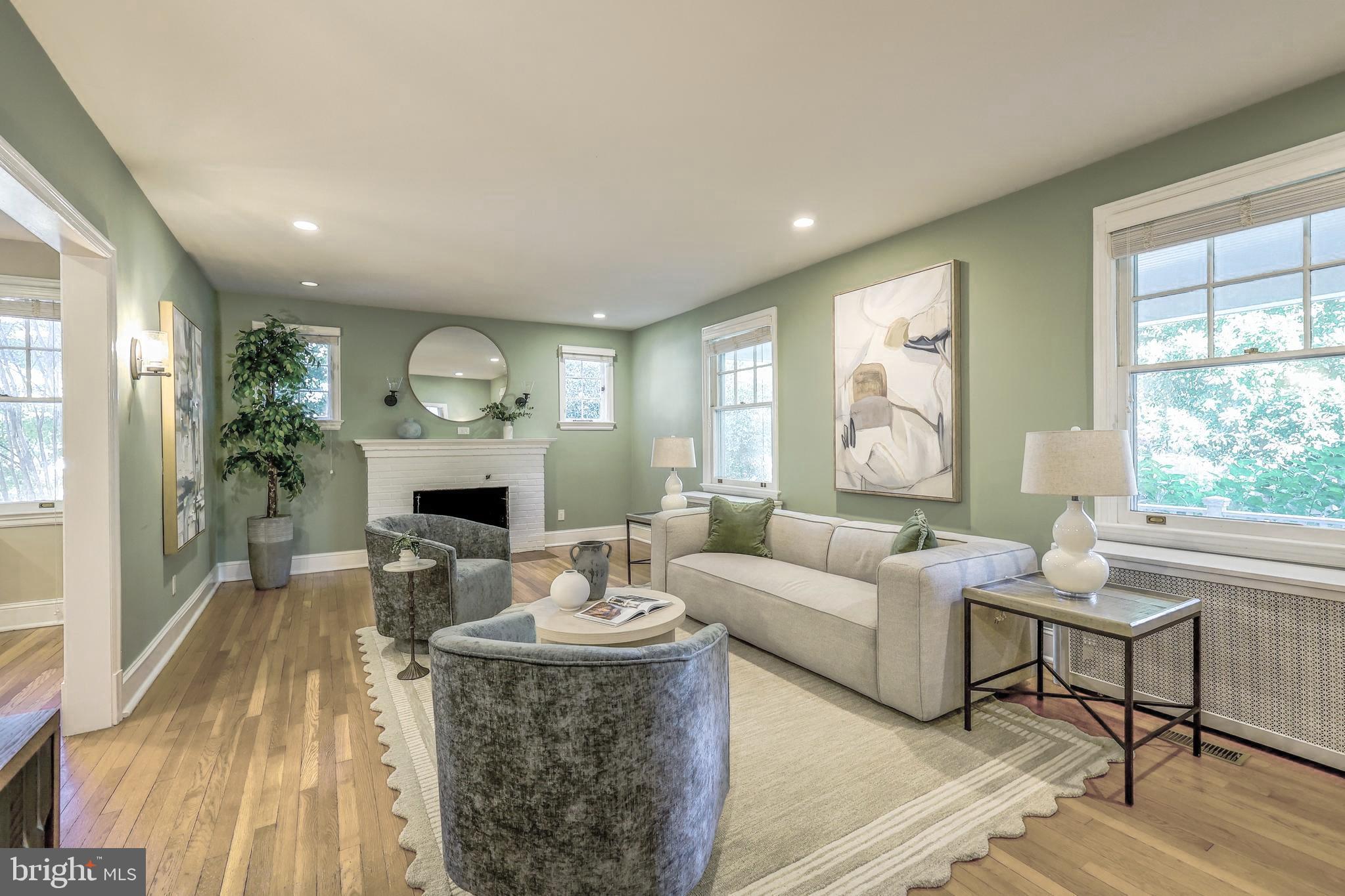 3230 Military Road Northwest Washington, DC 20015 - Photo 8 of 61 a living room with furniture a fireplace and a potted plant