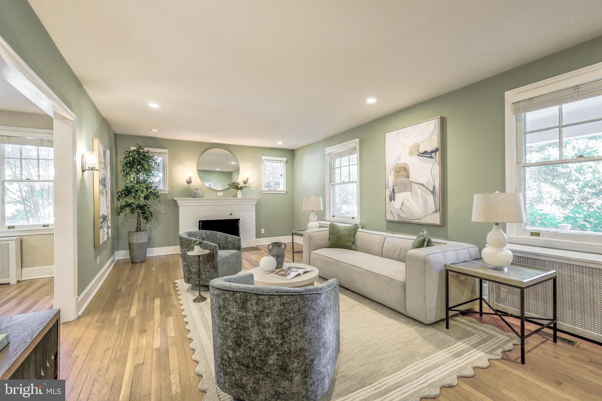 3230 Military Road Northwest Washington, DC 20015 - Photo 10 of 61 a living room with fireplace furniture and a large window