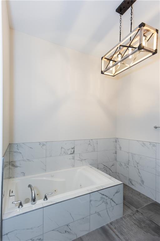 1907 Cambridge Avenue Atlanta, GA 30337 - Photo 11 of 24 a bathroom with a bathtub and shower