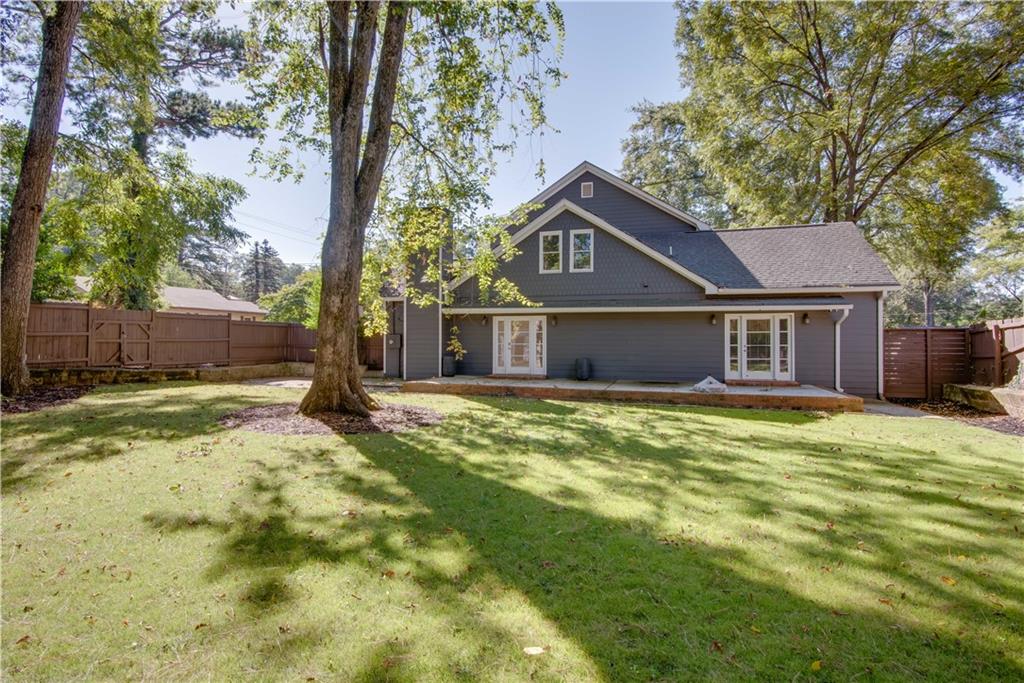 1907 Cambridge Avenue Atlanta, GA 30337 - Photo 24 of 24 a front view of a house with a yard