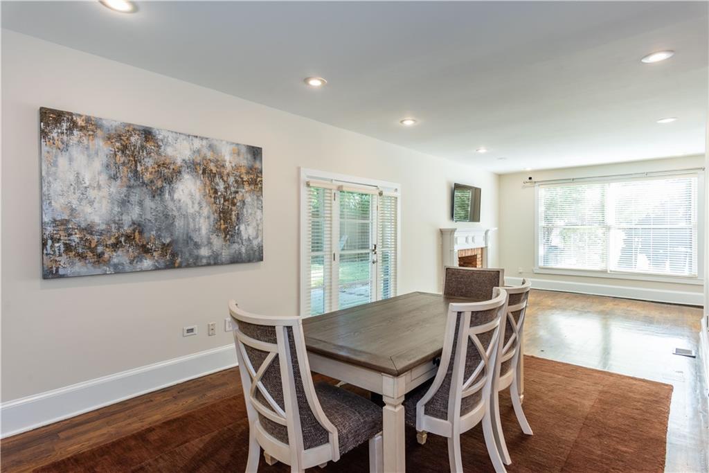 1907 Cambridge Avenue Atlanta, GA 30337 - Photo 7 of 24 a view of a dining room with furniture large window and wooden floor
