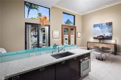 a kitchen with a sink stove and cabinets