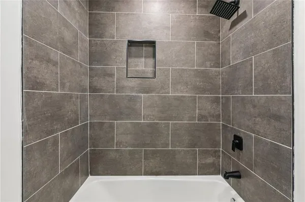 a bathroom with a sink and mirror