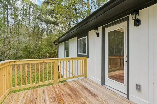 a view of a balcony with yard