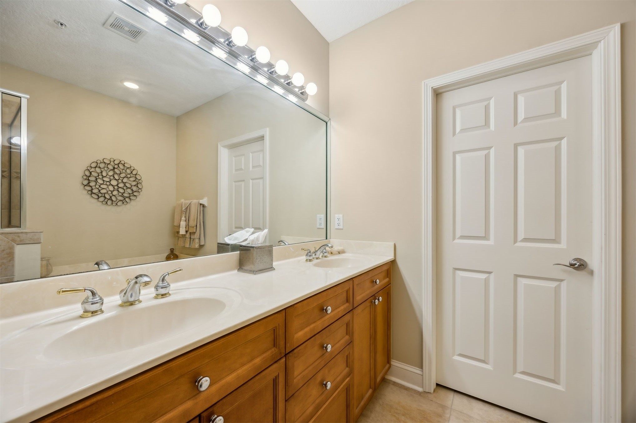 1839 Perimeter Park Road West, Unit 210 Fernandina Beach, FL 32034 - Photo 19 of 37 a bathroom with a double vanity sink and a mirror