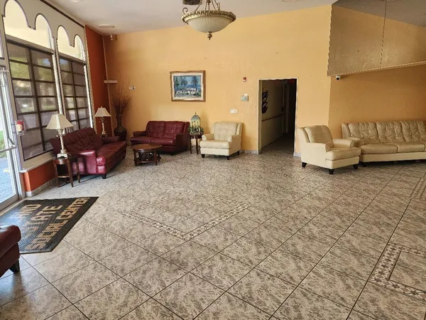 a living room with furniture and a rug