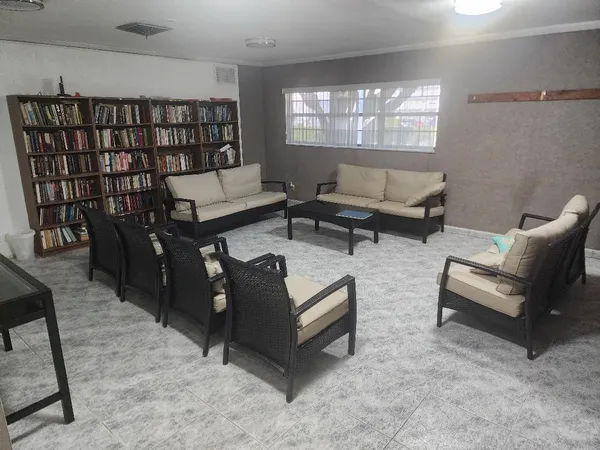 a living room with furniture and a rug