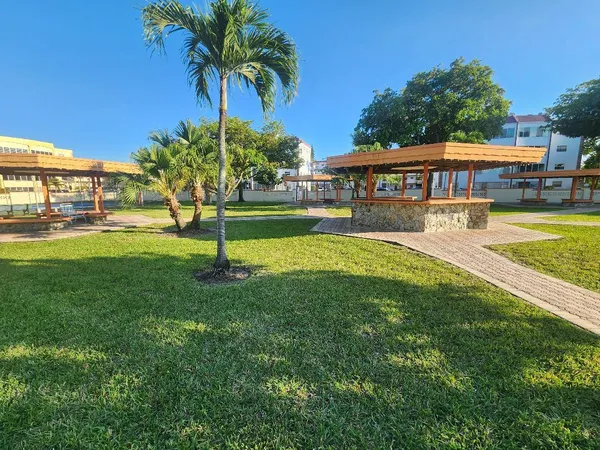 a house with swimming pool in front of it