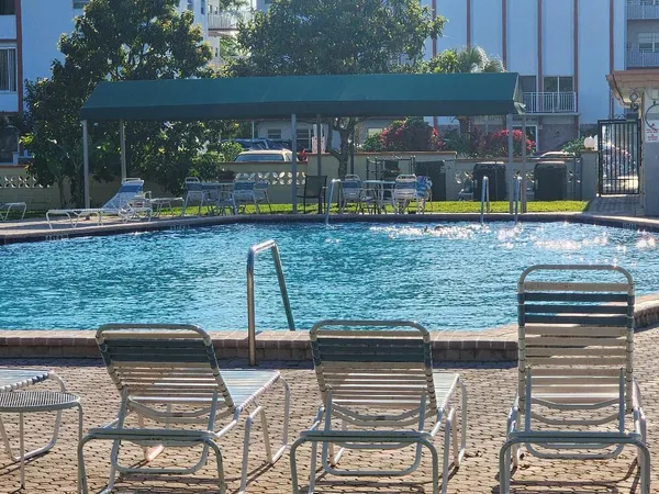 a view of a swimming pool with a patio