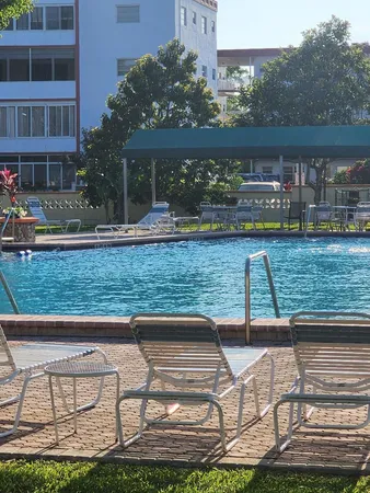 a view of a swimming pool with a patio