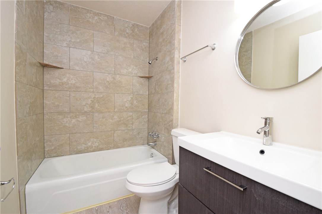 6400 Brookside Drive, Unit B Austin, TX 78723 - Photo 14 of 25 a bathroom with a sink and a mirror